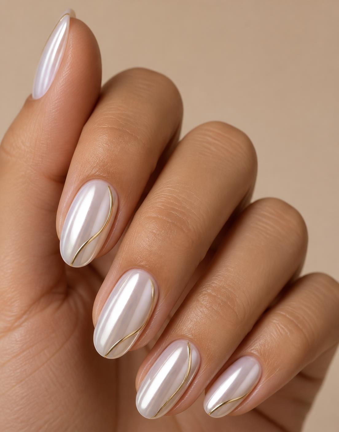 Close detail of pearl chrome nail art